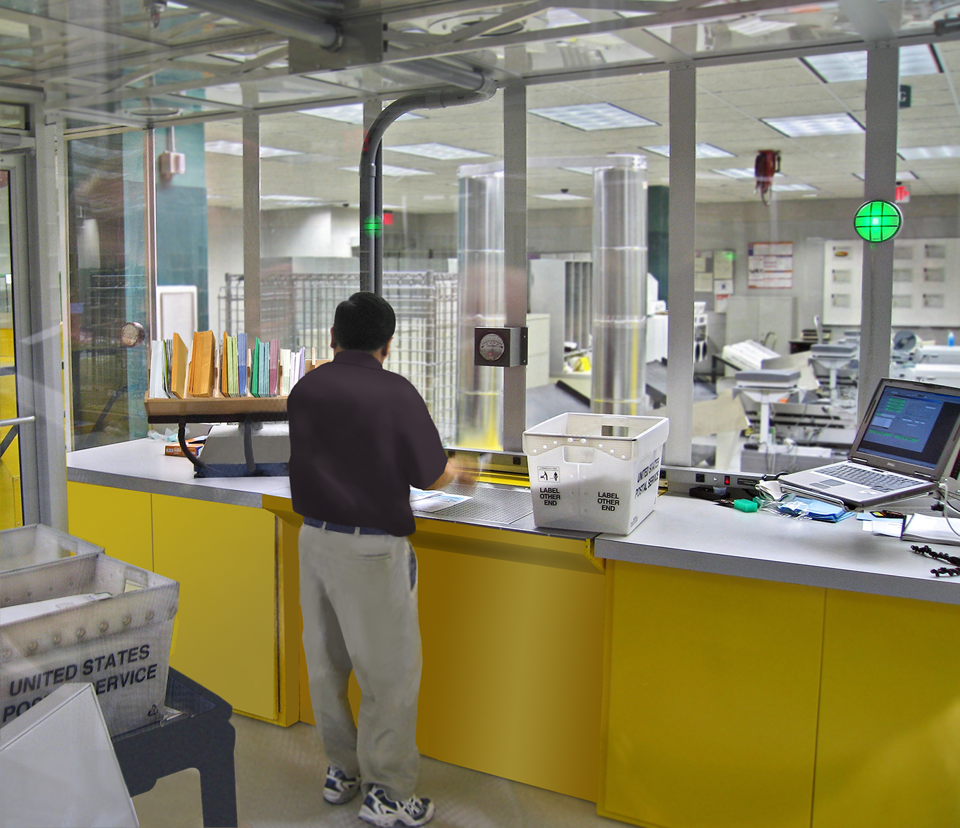ASAP III operator sorting mail over downdraft table